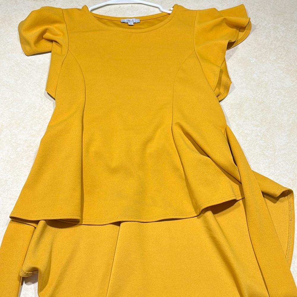 Iris blouse with ruffles and attached belt. size: women’s Large. like new.